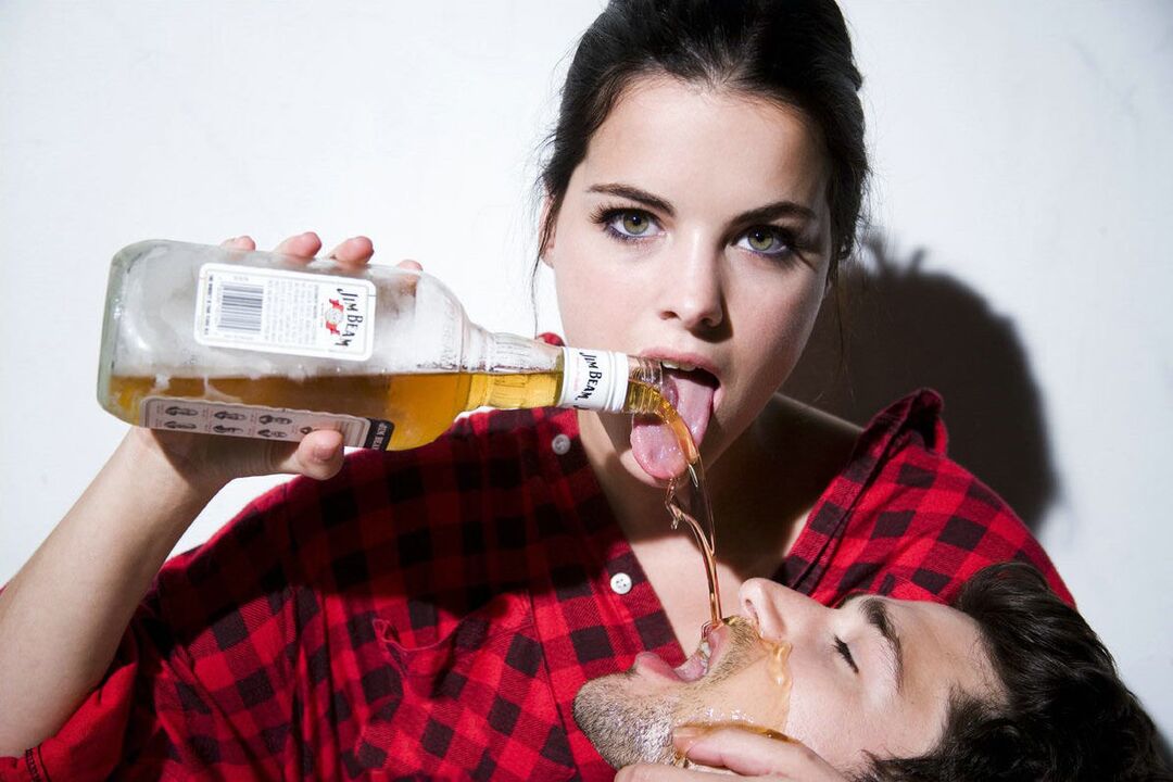 a girl pours alcohol on a man before sex